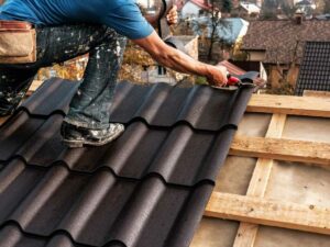 Roofing professionals replacing an old roof with new shingles on a Chicago home.