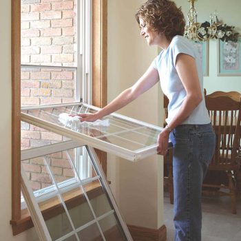 Cleaning double-hung window with tilt-in feature